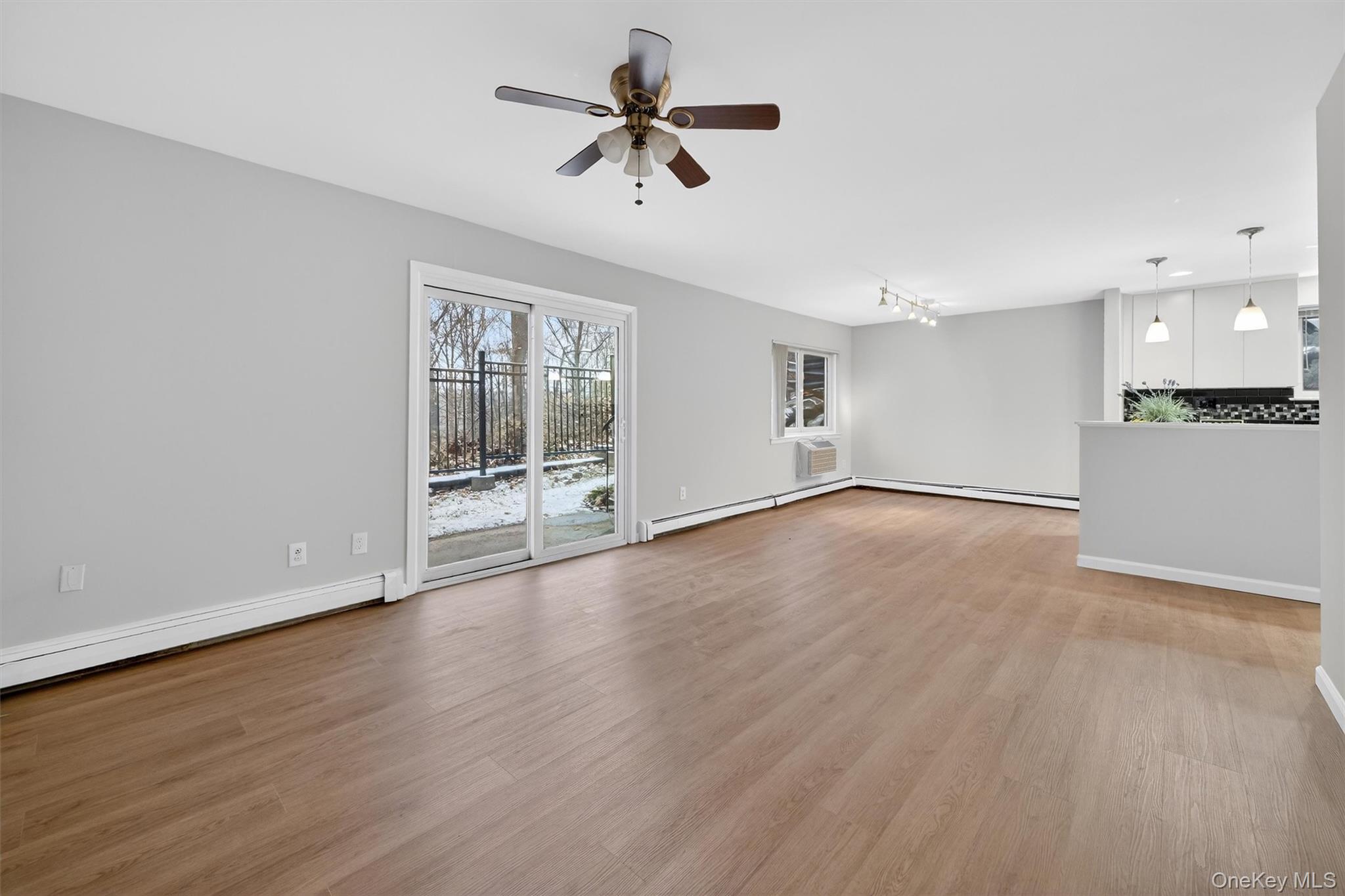 14 Scenic Drive, Unit 14T Croton-on-Hudson, NY 10520 - Photo 19 of 29 a view of an empty room with a window and wooden floor