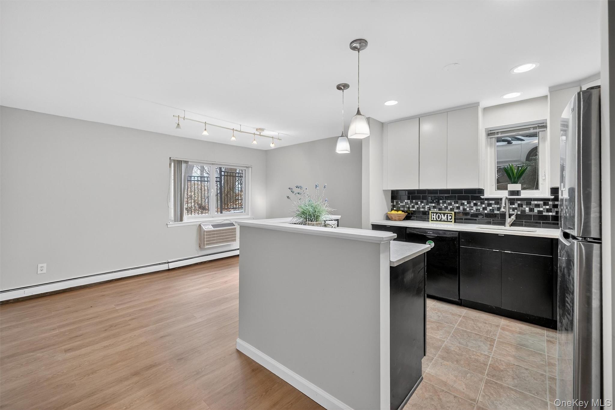 14 Scenic Drive, Unit 14T Croton-on-Hudson, NY 10520 - Photo 4 of 29 a kitchen with a refrigerator and a stove top oven