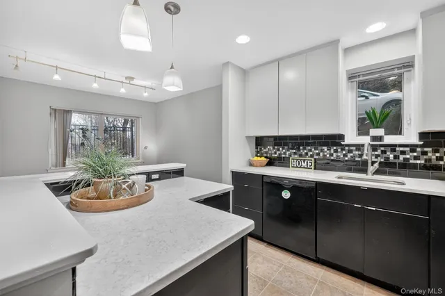 a kitchen with a sink and stove