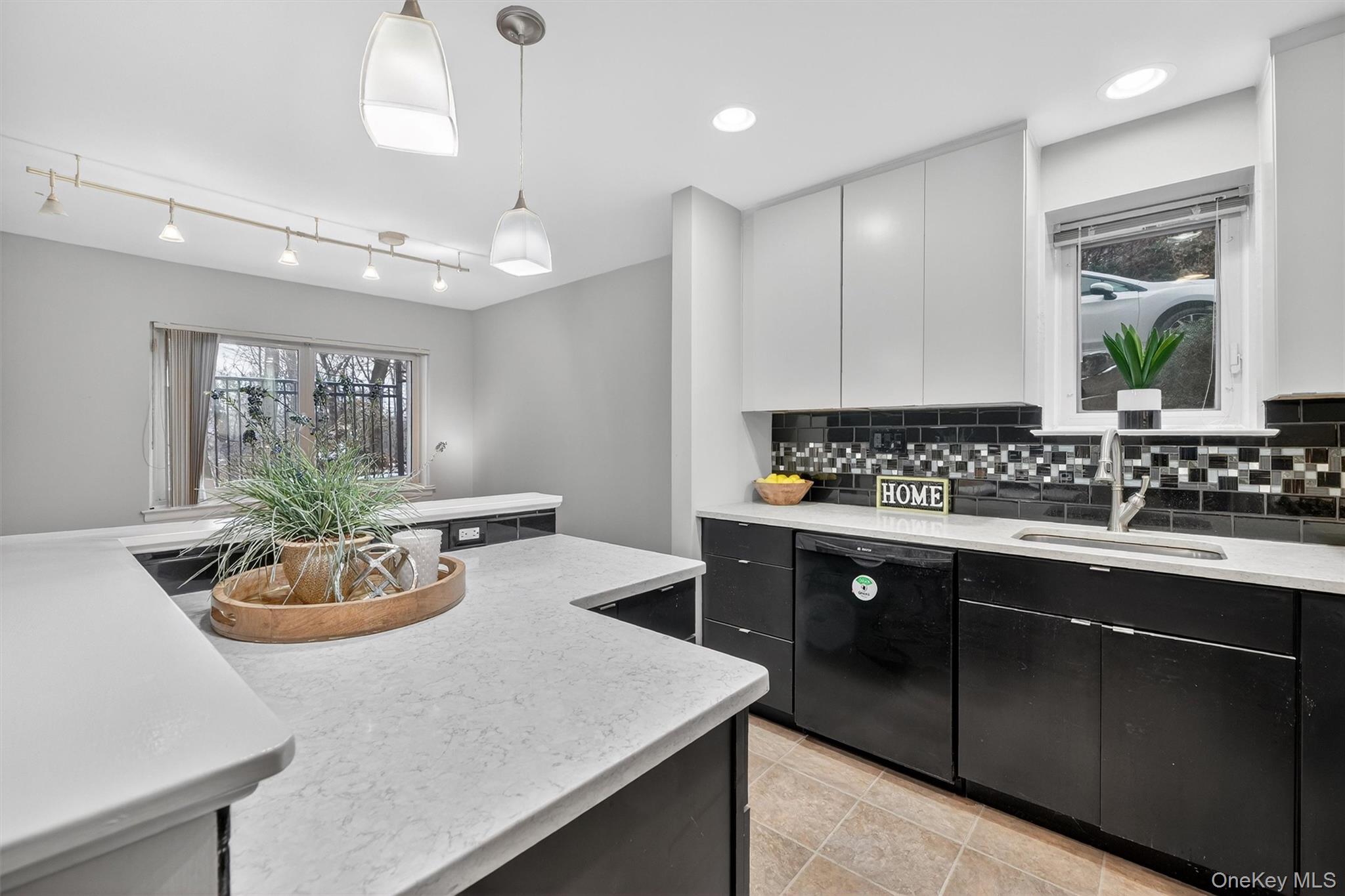 14 Scenic Drive, Unit 14T Croton-on-Hudson, NY 10520 - Photo 5 of 29 a kitchen with a sink and stove