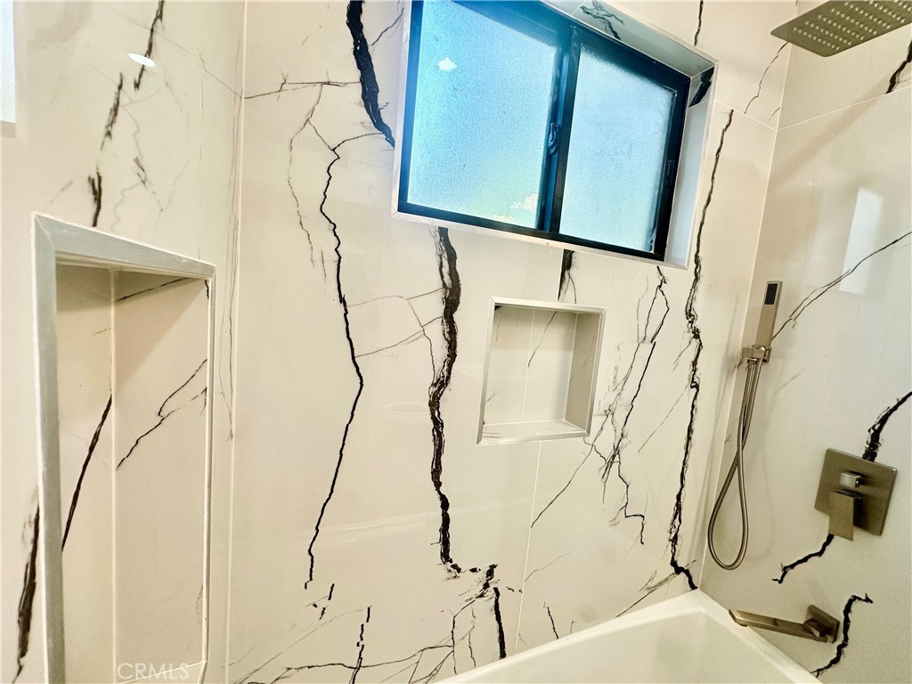 301 Ashland Avenue, Unit 2 Santa Monica, CA 90405 - Photo 15 of 24 a bathroom with a bathtub and shower