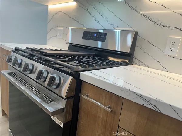 a kitchen with a sink and a refrigerator