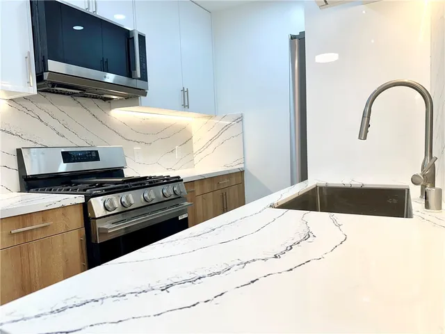 a bathroom with a bathtub and a sink