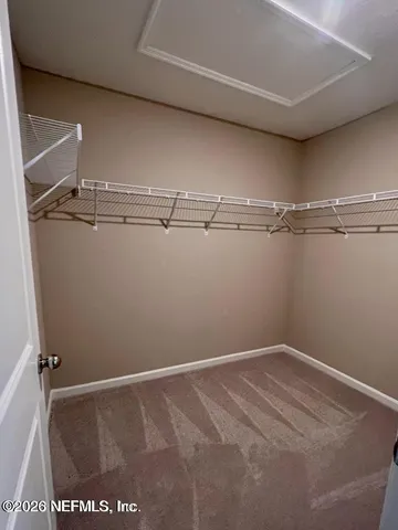 a view of a room with racks on the wall