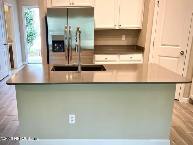 a kitchen with a sink and an oven