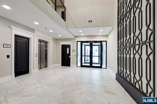 a view of an entryway with wooden floor
