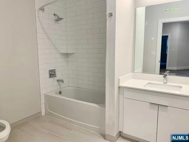 a bathroom with a bathtub and a sink