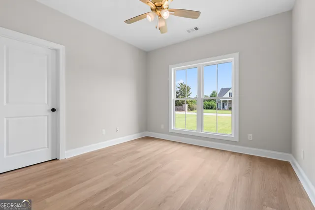 a view of an empty room with a window