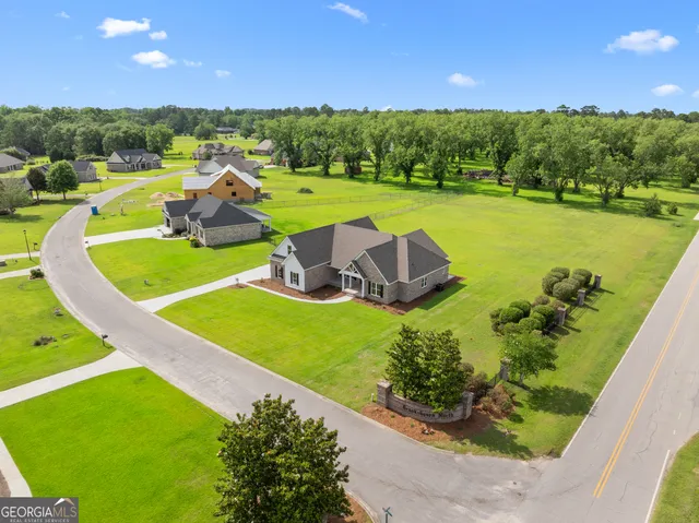 a view of a swimming pool and a yard