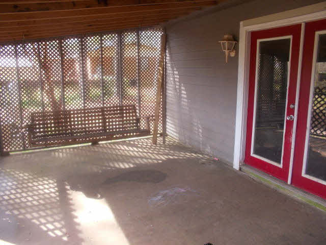 18812 Crocker Lane Foley, AL 36535 - Photo 12 of 14 enclosed back porch with swing
