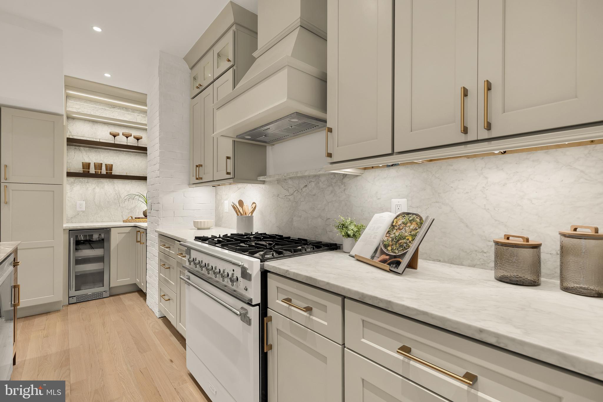 1249 4th Street Northwest Washington, DC 20001 - Photo 15 of 32 a kitchen with stainless steel appliances granite countertop a stove and a white cabinets