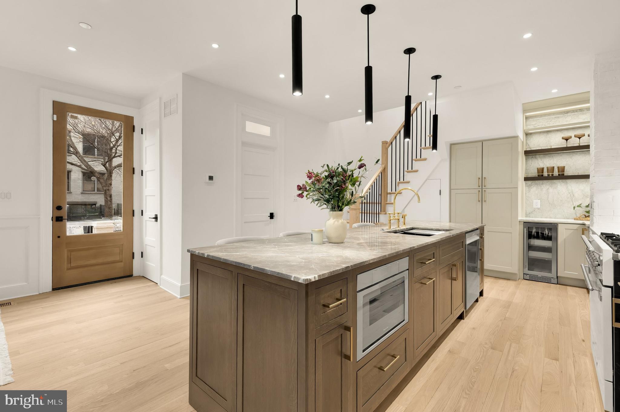 1249 4th Street Northwest Washington, DC 20001 - Photo 16 of 32 a kitchen with stainless steel appliances granite countertop a kitchen island a stove and a sink