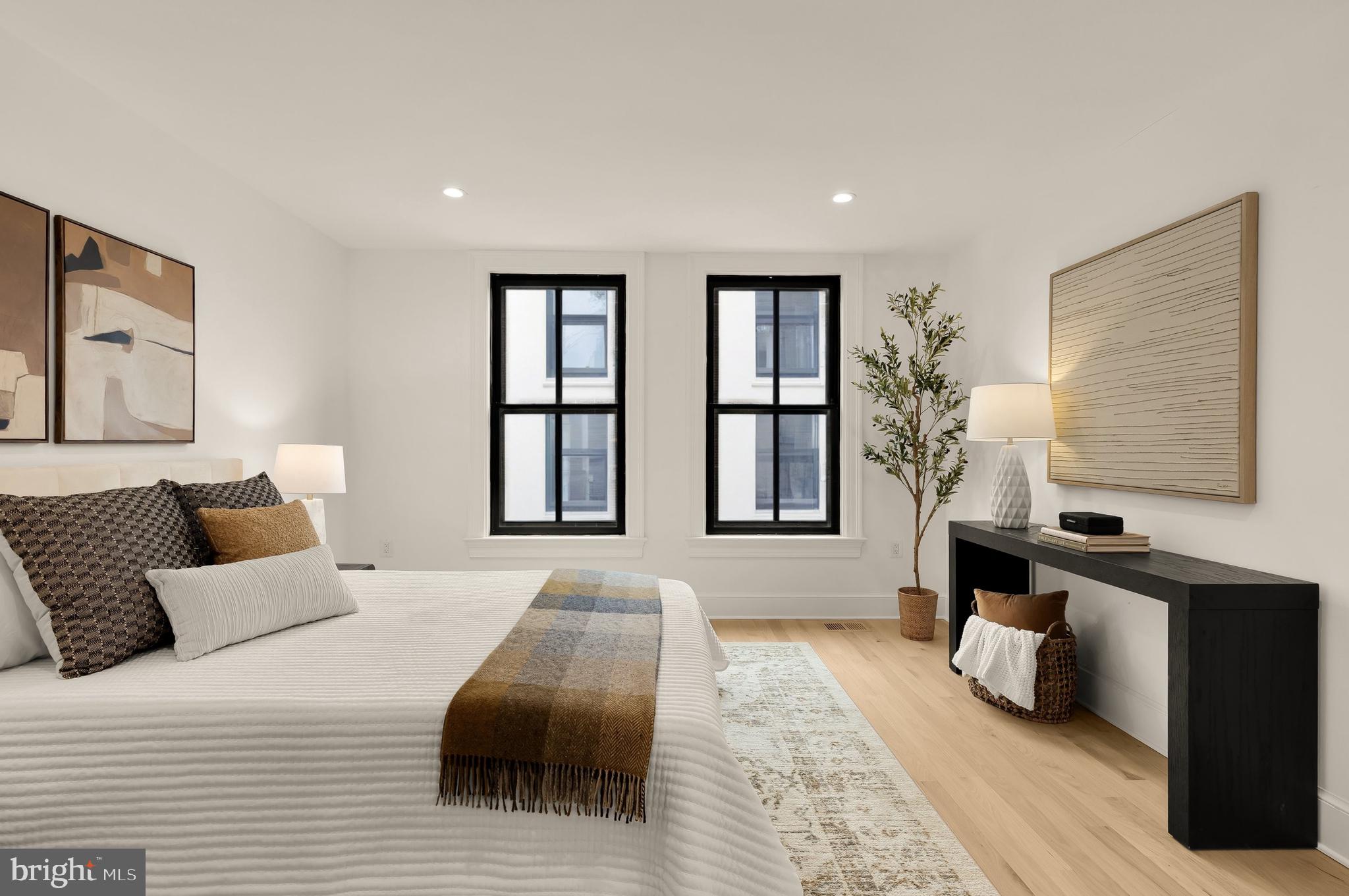 1249 4th Street Northwest Washington, DC 20001 - Photo 18 of 32 a bedroom with a bed and wooden floor