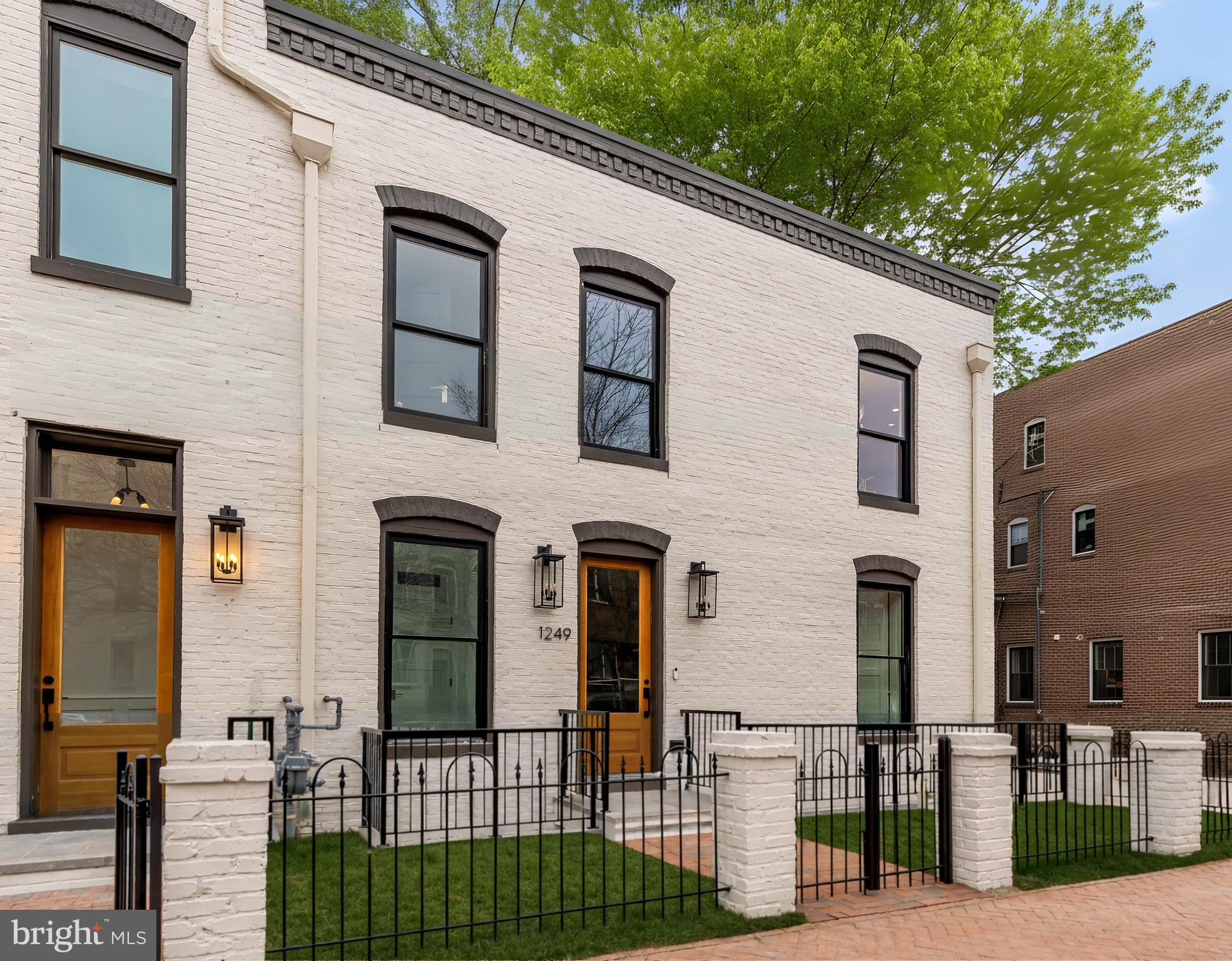 1249 4th Street Northwest Washington, DC 20001 - Photo 2 of 32 a view of a brick house with many windows
