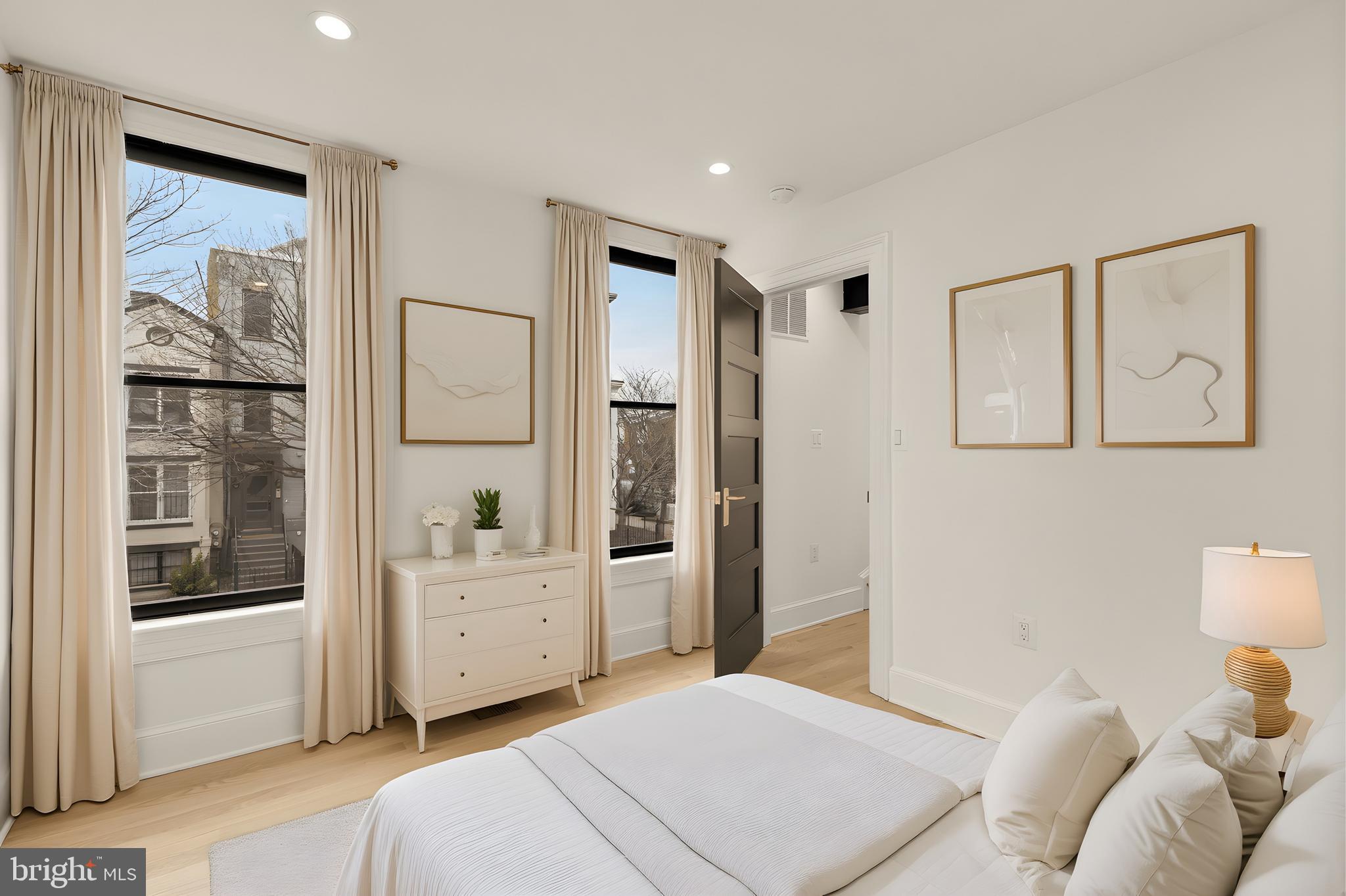 1249 4th Street Northwest Washington, DC 20001 - Photo 21 of 32 a bedroom with a large bed and a window