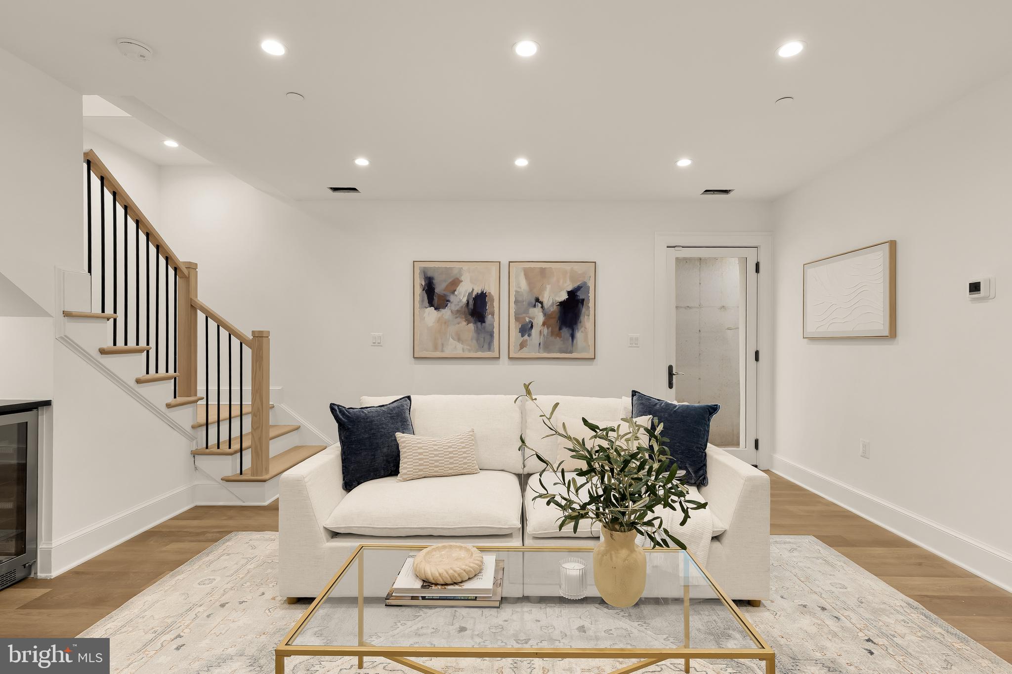 1249 4th Street Northwest Washington, DC 20001 - Photo 24 of 32 a living room with furniture and wooden floor