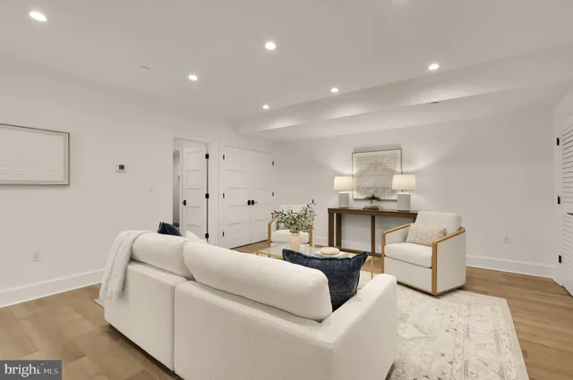 a living room with furniture and white walls