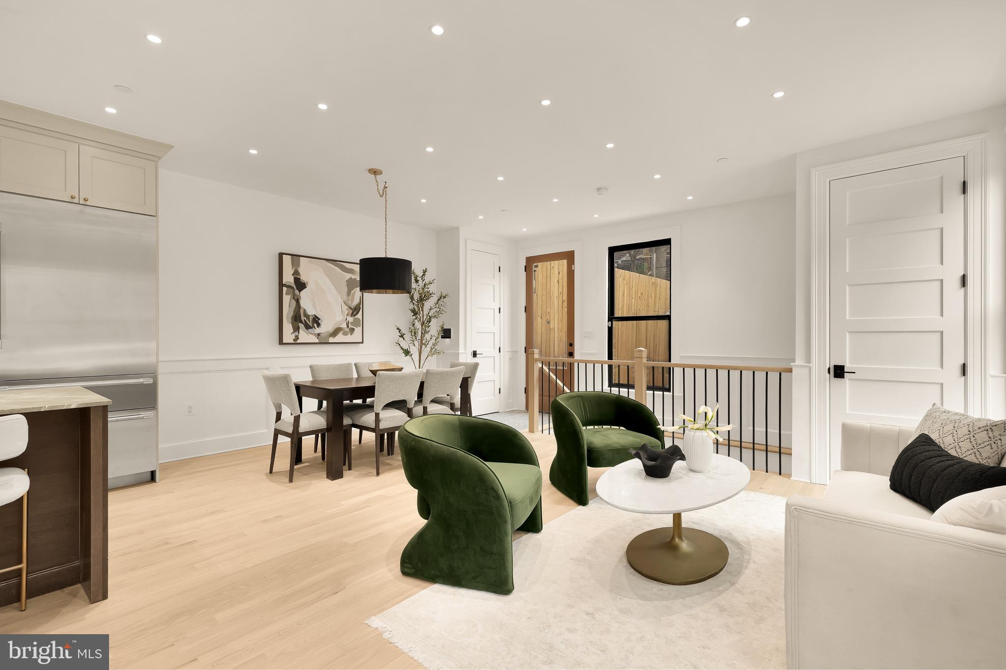 1249 4th Street Northwest Washington, DC 20001 - Photo 3 of 32 a living room with furniture kitchen view and a large window