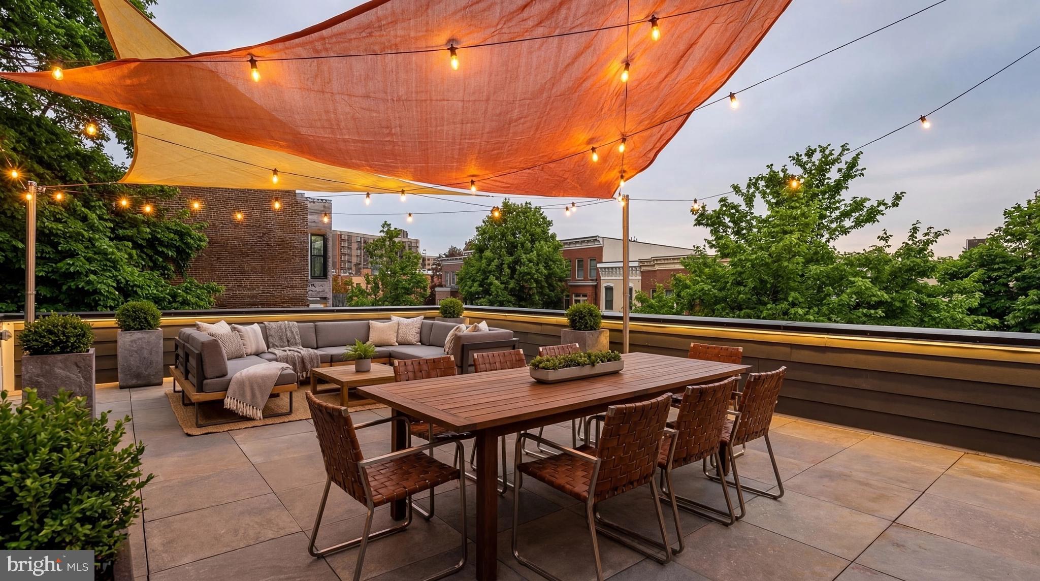 1249 4th Street Northwest Washington, DC 20001 - Photo 31 of 32 a backyard of a house with table and chairs