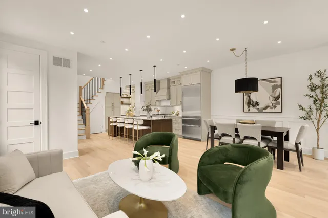 a dining room with furniture and a window