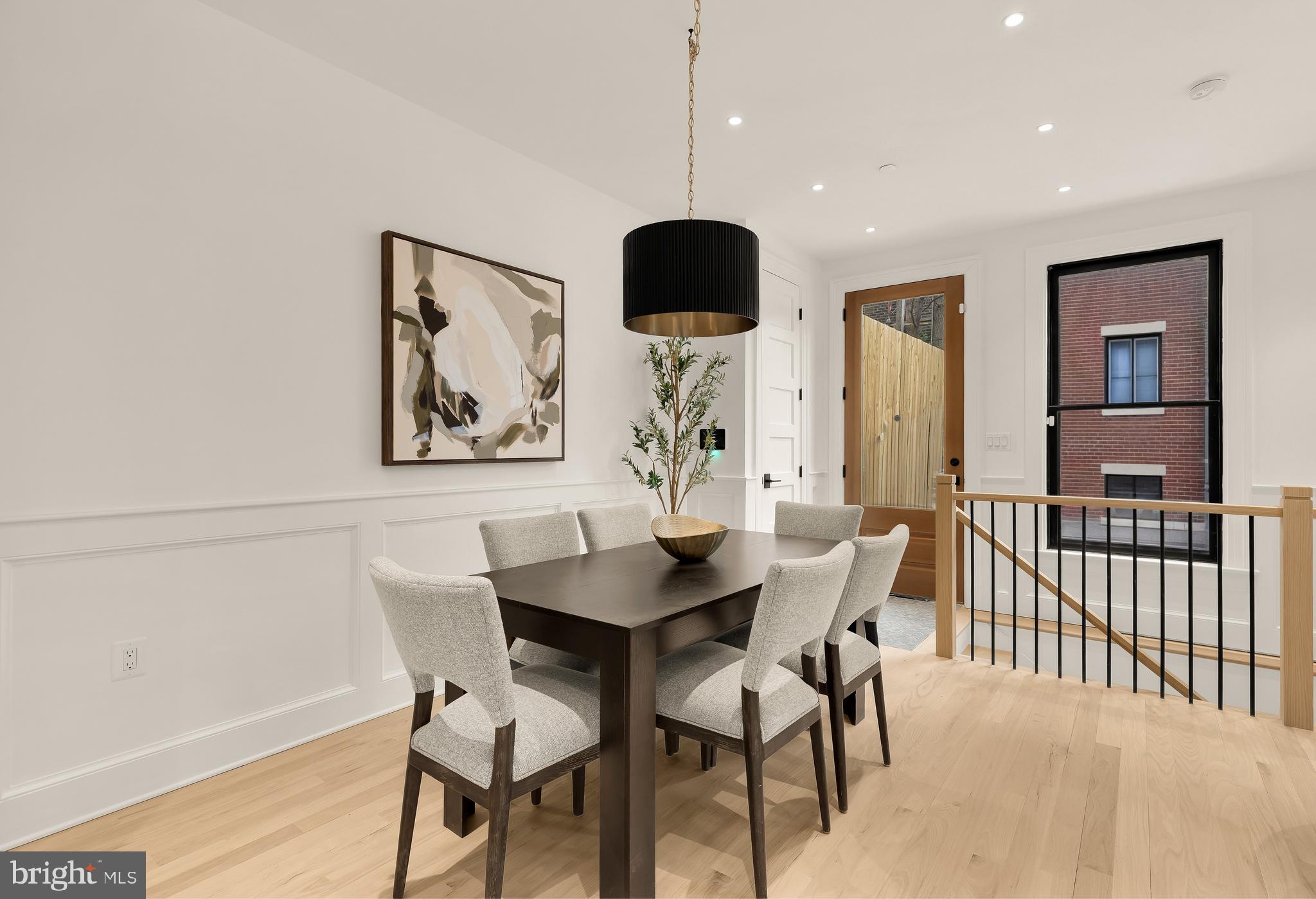 1249 4th Street Northwest Washington, DC 20001 - Photo 8 of 32 a view of a dining room with furniture and wooden floor