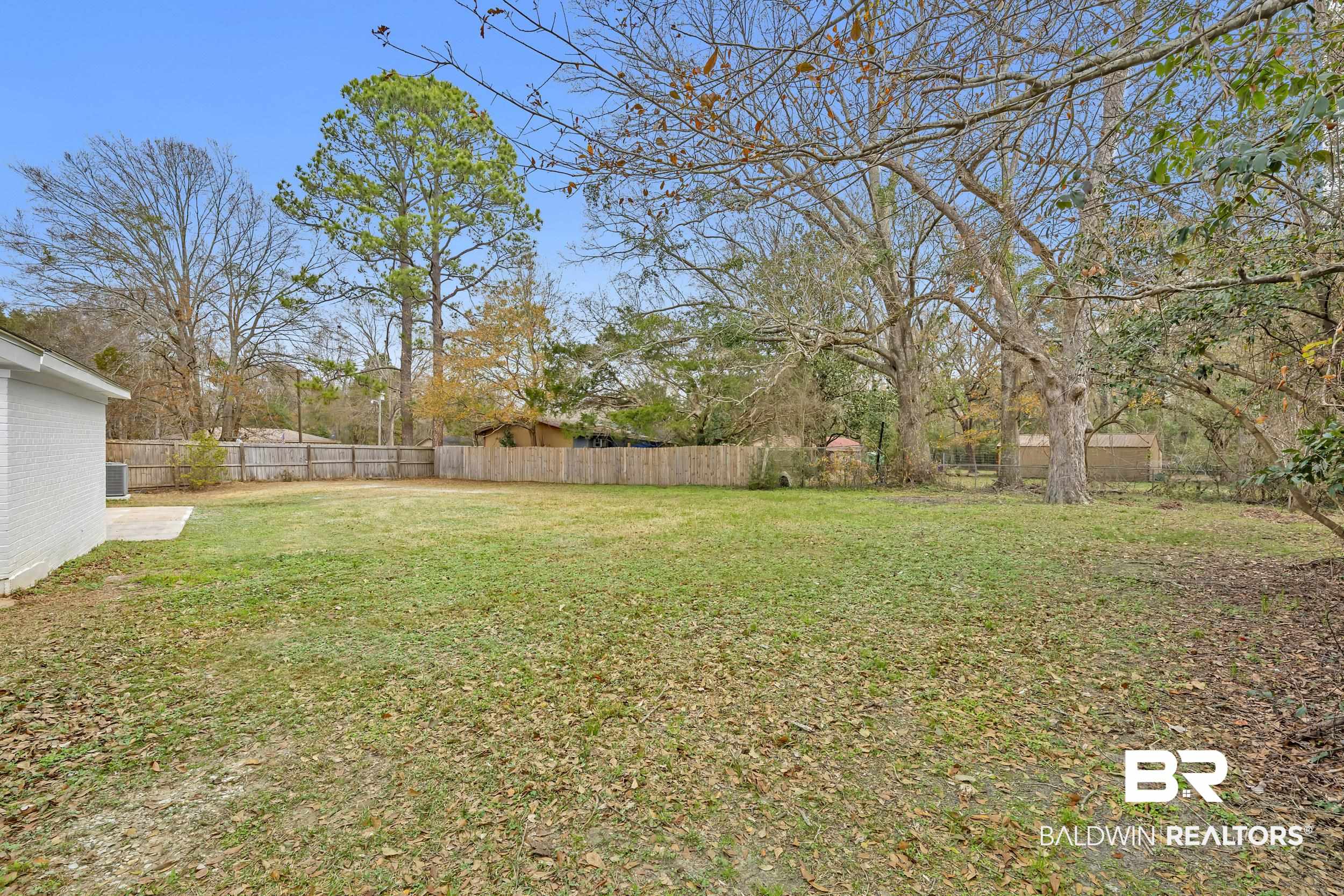 11381 Normandy Drive East Semmes, AL 36575 - Photo 22 of 23 View of fenced backyard