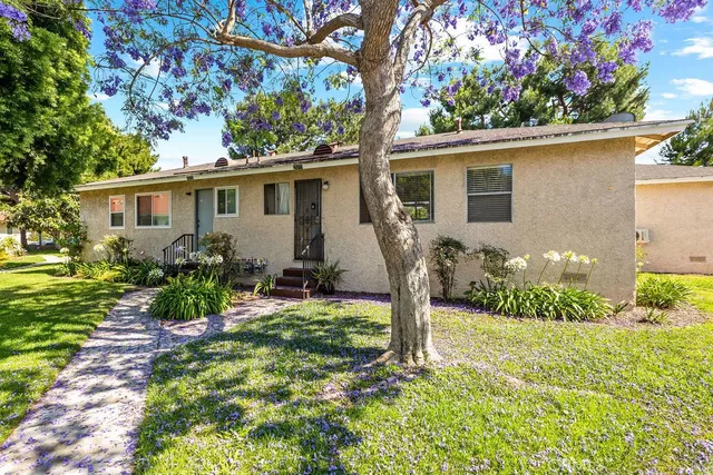a house view with a garden space