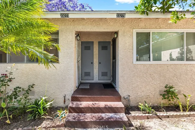 a front view of a house with a garage