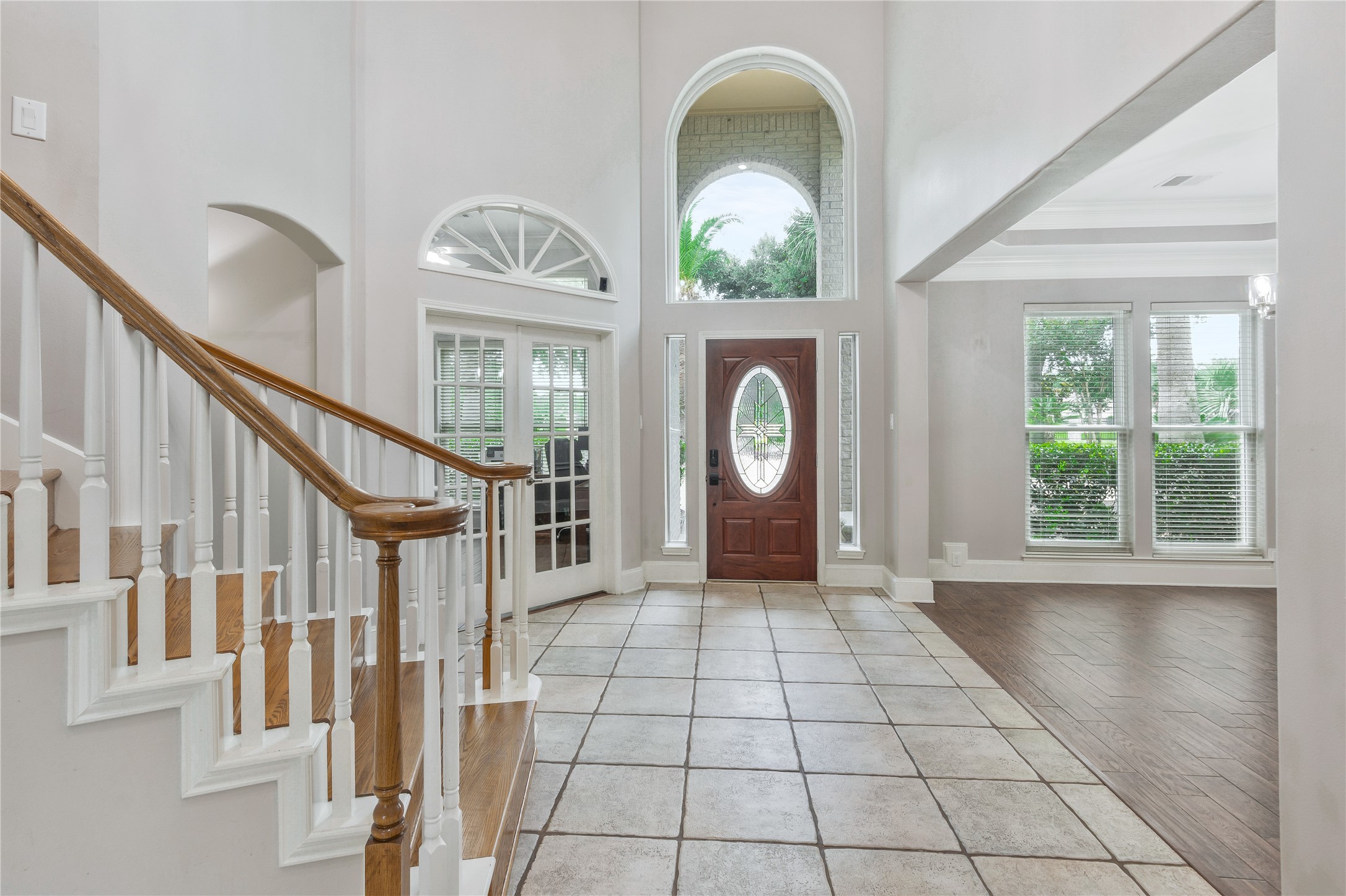 13914 Skinner Road Cypress, TX 77429 - Photo 7 of 50 Two story entry with a curved staircase, tall windows, tile flooring, and plenty of natural light.