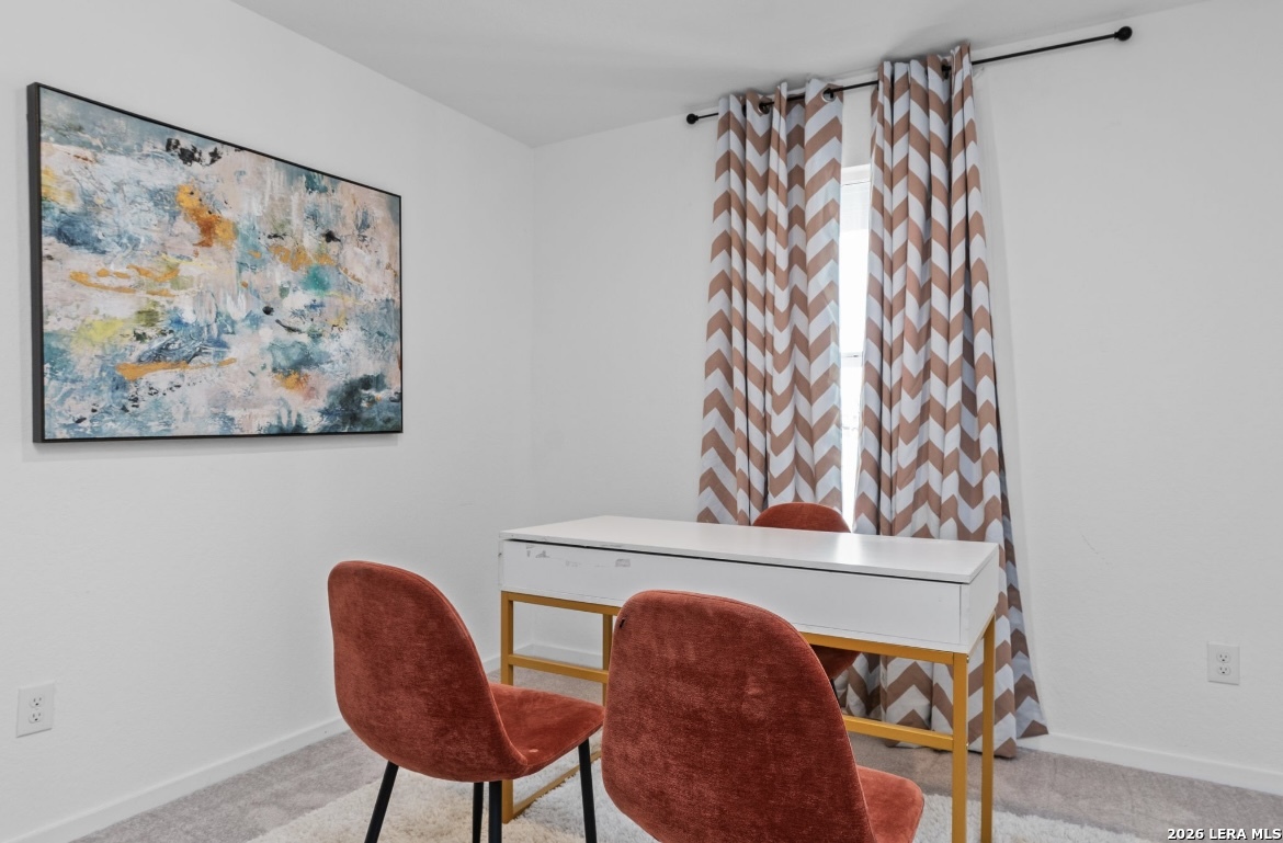 3849 High Tide Seguin, TX 78155 - Photo 11 of 15 a view of a workspace with furniture and a painting on the wall