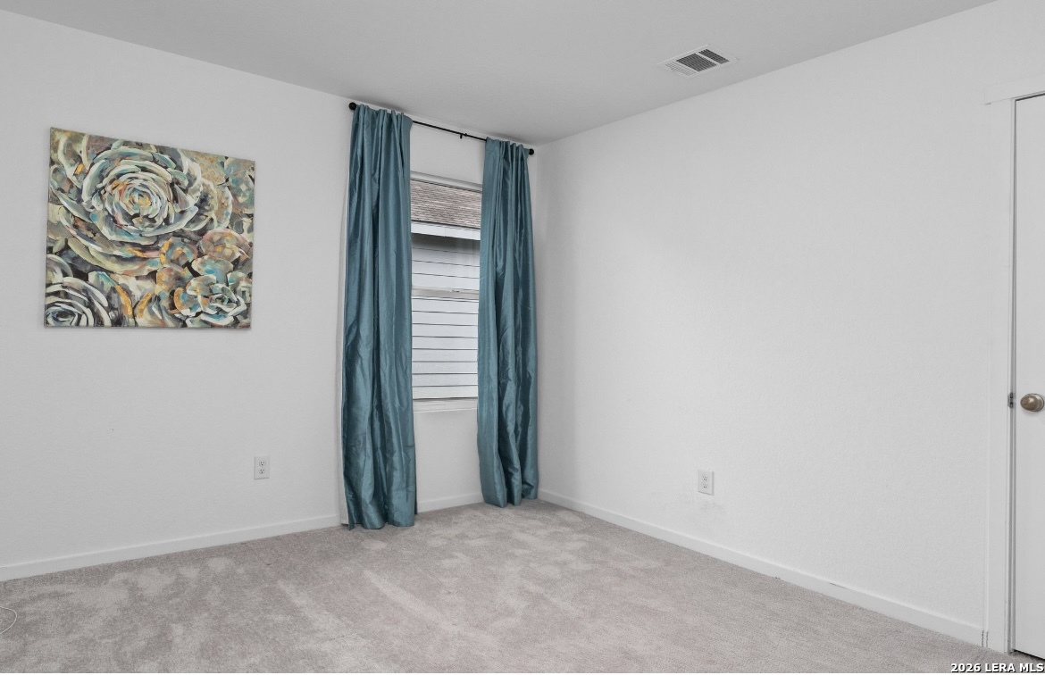 3849 High Tide Seguin, TX 78155 - Photo 12 of 15 an empty room with painting on the wall