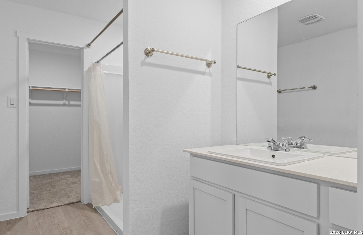 3849 High Tide Seguin, TX 78155 - Photo 5 of 15 a bathroom with a sink and a mirror