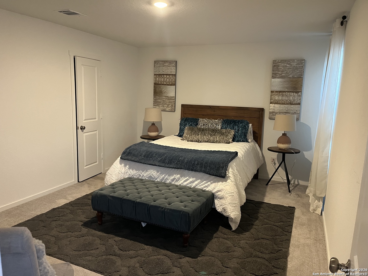 3849 High Tide Seguin, TX 78155 - Photo 7 of 15 a bedroom with a bed and wooden floor