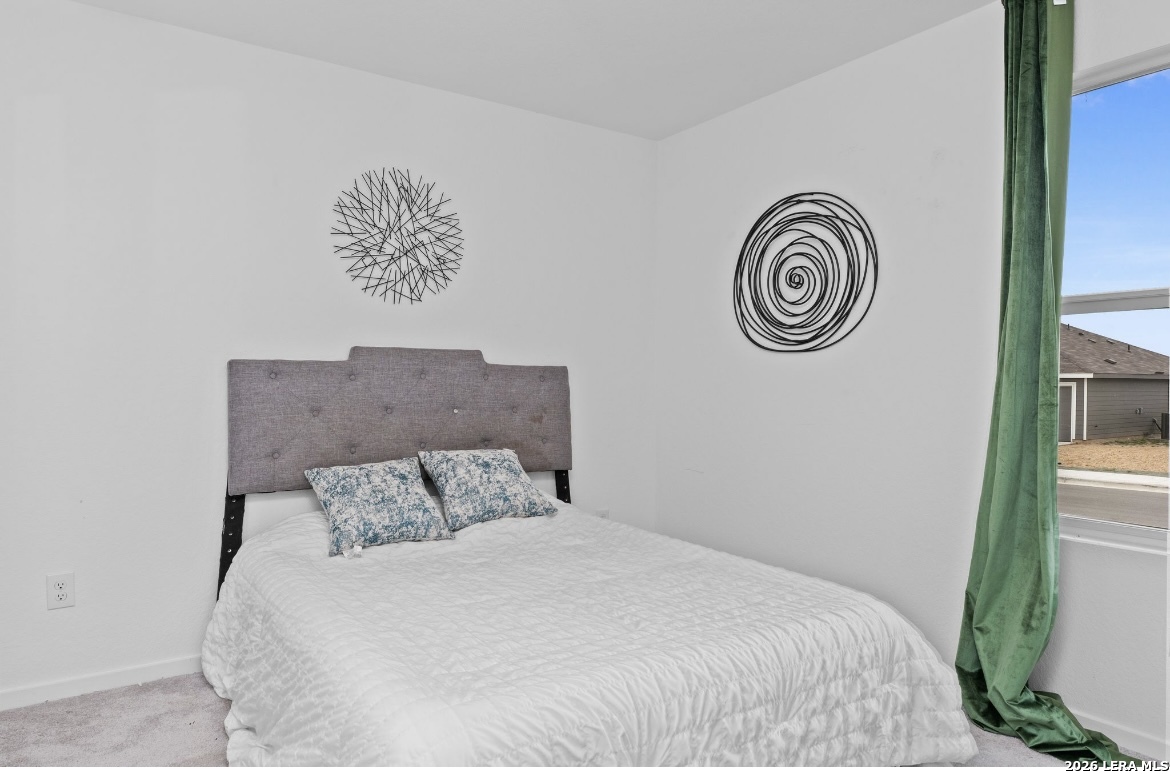 3849 High Tide Seguin, TX 78155 - Photo 10 of 15 a bedroom with a bed and a window