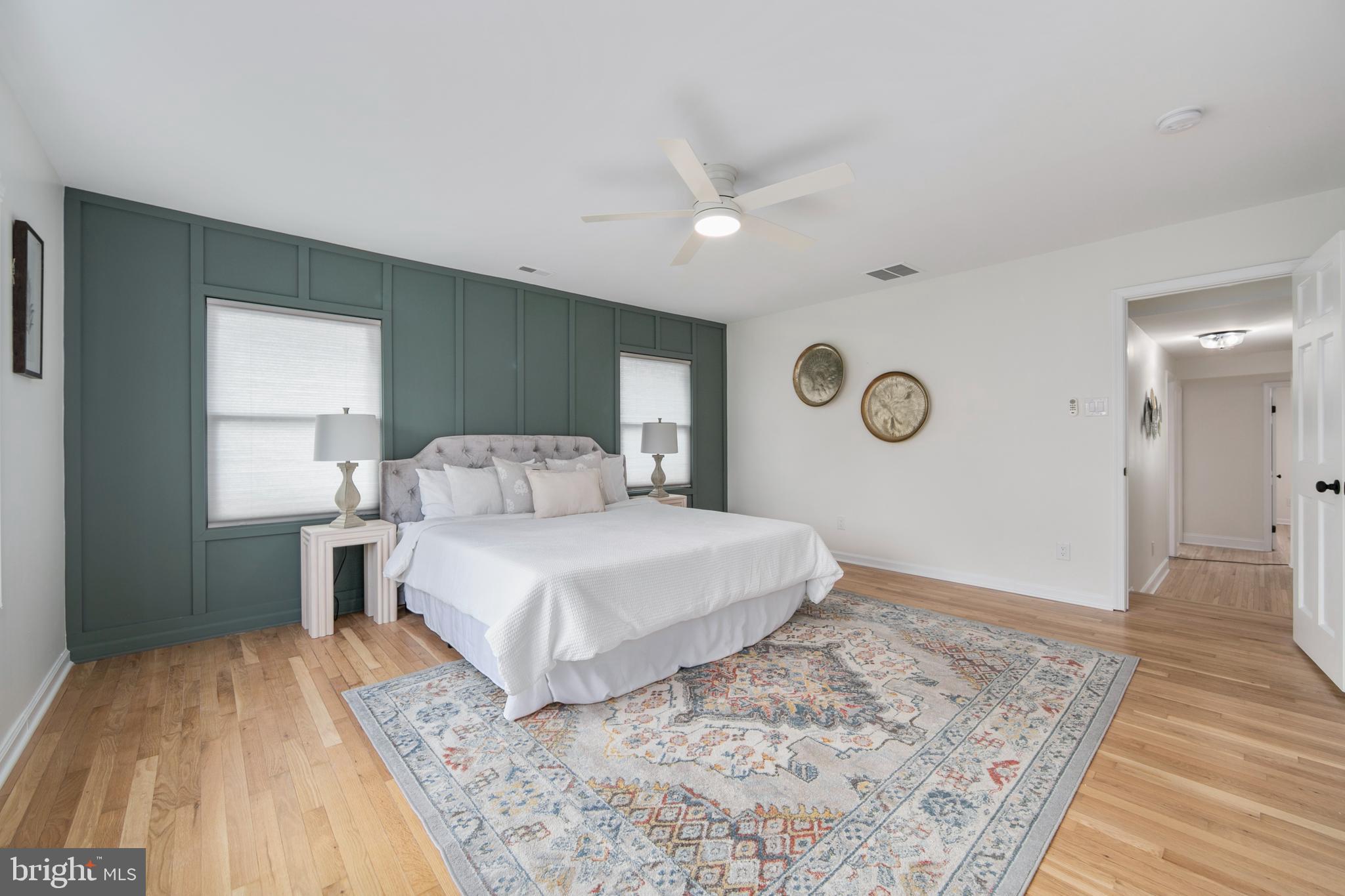 308 Farmdale Road Moorestown, NJ 08057 - Photo 16 of 47 a bedroom with a large bed and a chandelier
