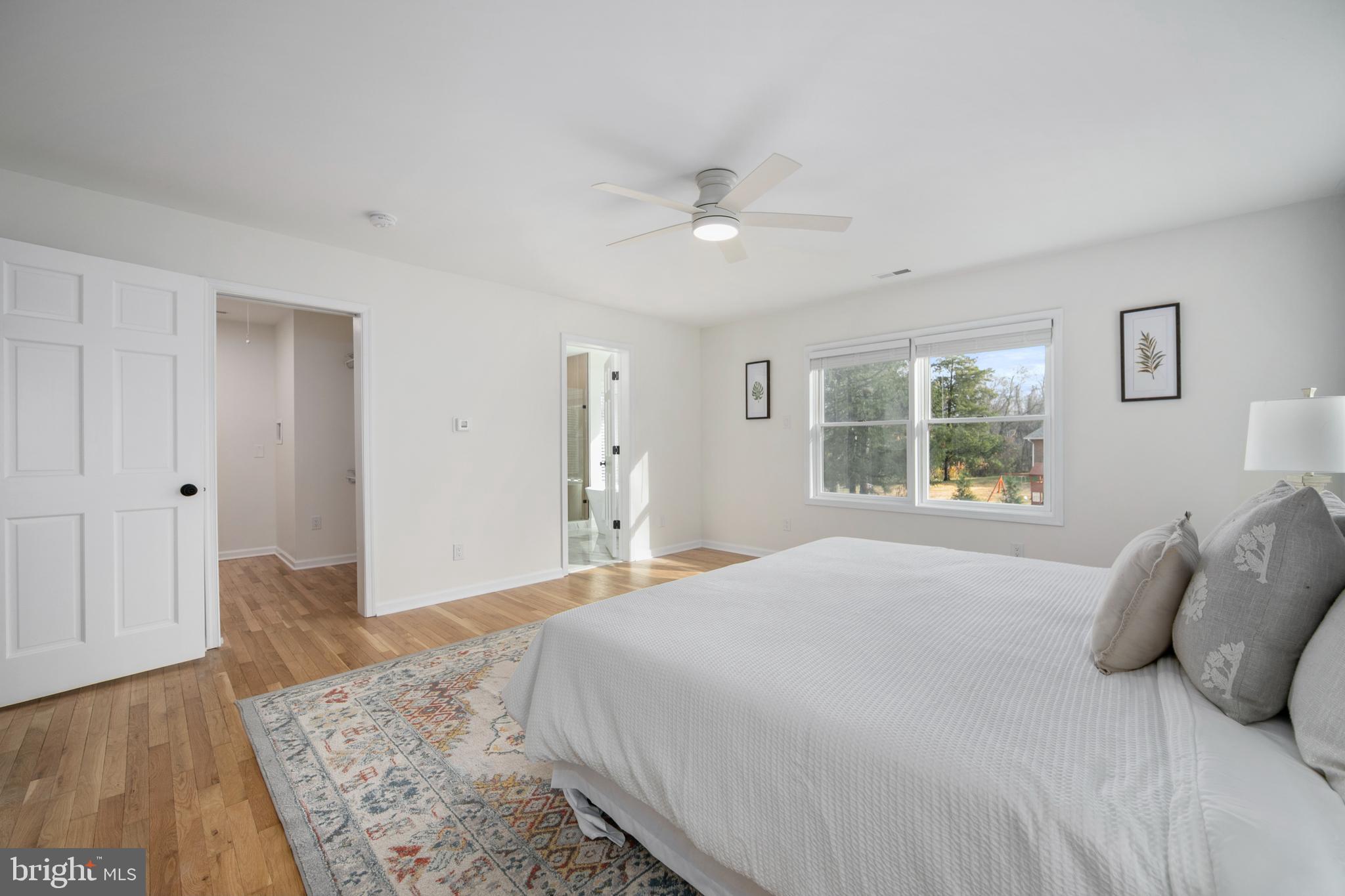 308 Farmdale Road Moorestown, NJ 08057 - Photo 17 of 47 a bedroom with a large bed and wooden floor