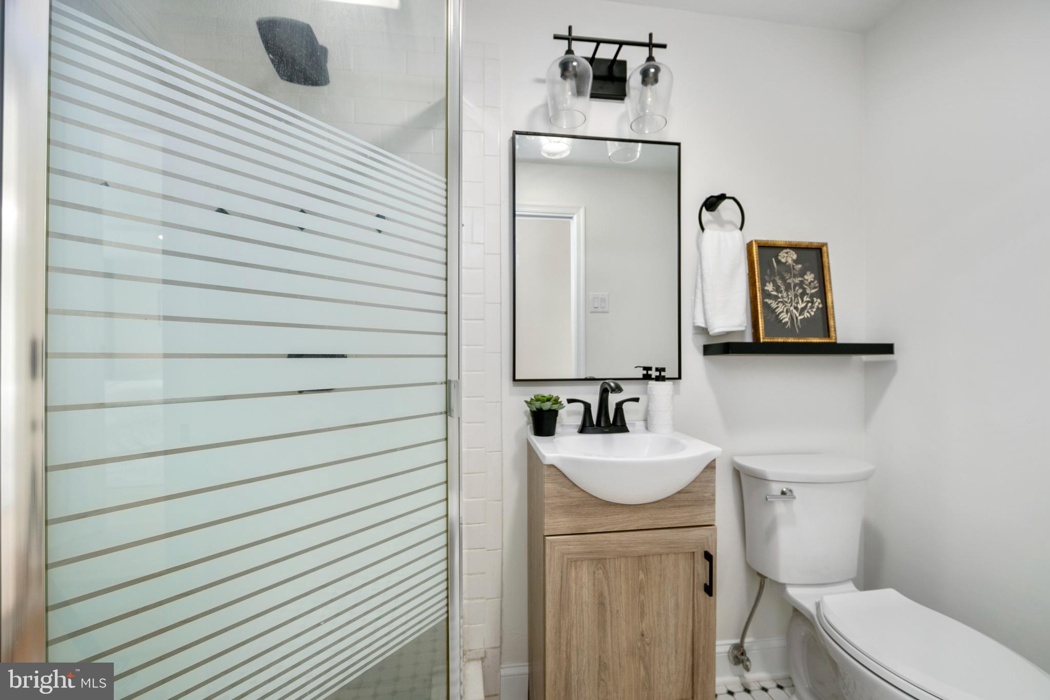 308 Farmdale Road Moorestown, NJ 08057 - Photo 22 of 47 a bathroom with a sink toilet and mirror