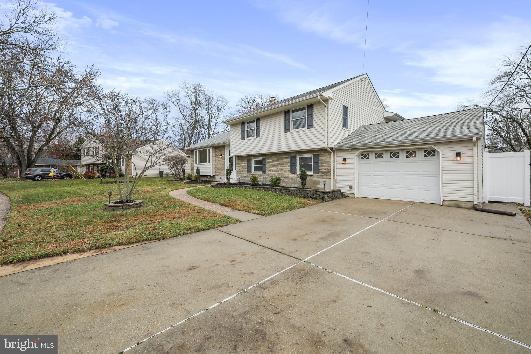 308 Farmdale Road Moorestown, NJ 08057 - Photo 3 of 47 a view of a white house with a yard and garage