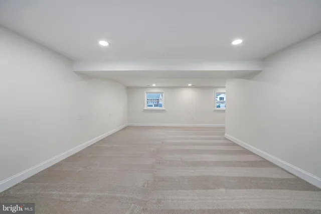 a bathroom with a sink mirror and toilet