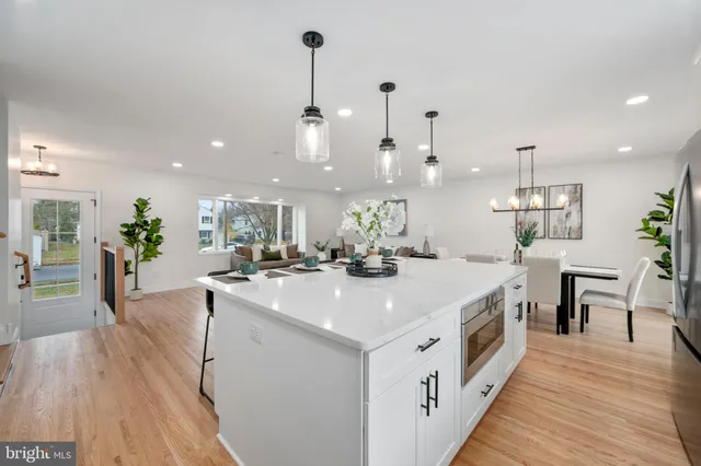 a large white kitchen with lots of counter space