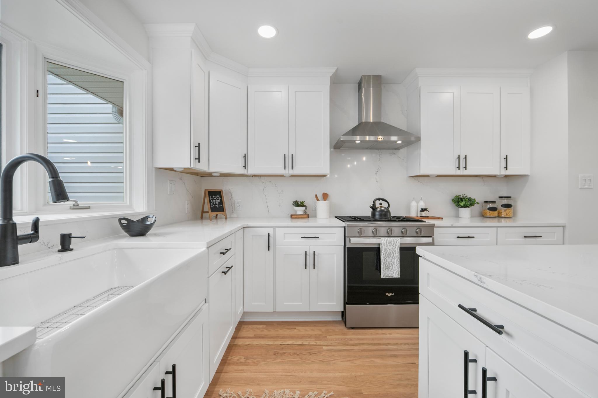 308 Farmdale Road Moorestown, NJ 08057 - Photo 8 of 47 a kitchen with white cabinets stainless steel appliances and sink