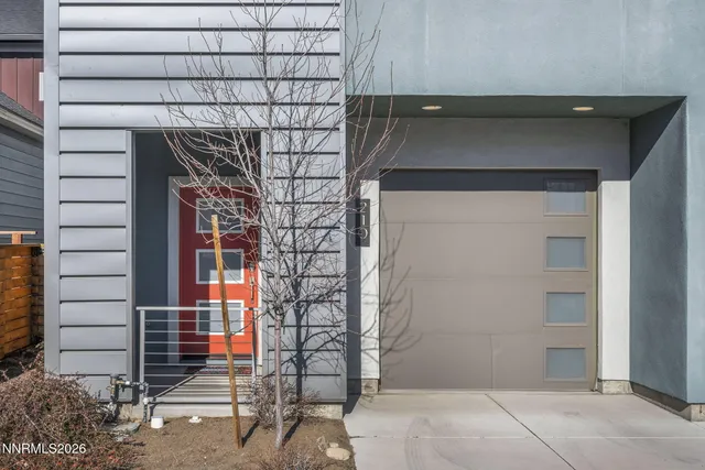 a front view of a house with a garage