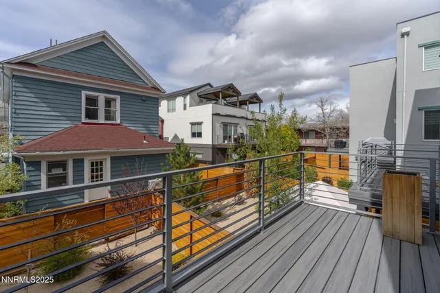 a kitchen with refrigerator cabinets and wooden floor