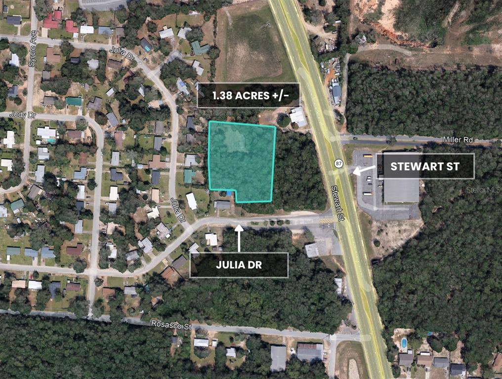 Julia Drive Milton, FL 32570 - Photo 12 of 21 a sign that is sitting on a brick wall