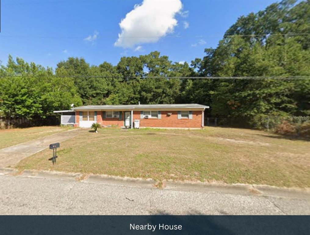 Julia Drive Milton, FL 32570 - Photo 8 of 21 a view of a swimming pool with a yard