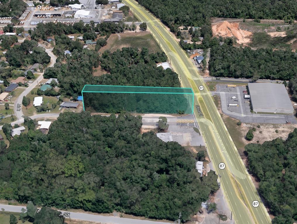 Julia Drive Milton, FL 32570 - Photo 10 of 21 an aerial view of a house with a yard basket ball court and outdoor seating