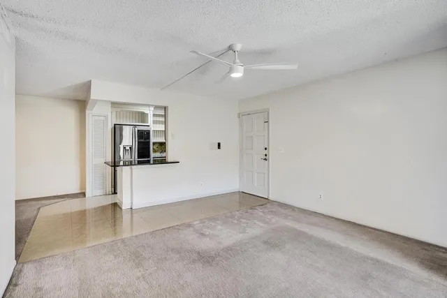 a kitchen with cabinets and stainless steel appliances