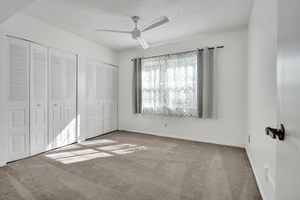 1050 Northwest 13th Street, Unit 193D Boca Raton, FL 33486 - Photo 19 of 55 a view of an empty room with a window