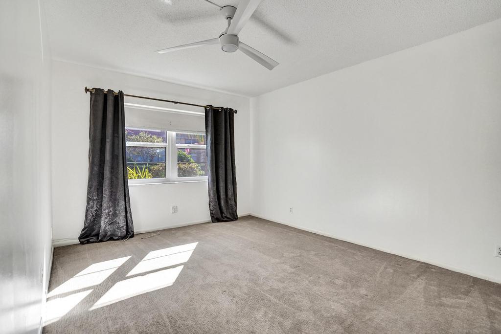 1050 Northwest 13th Street, Unit 193D Boca Raton, FL 33486 - Photo 21 of 55 a view of an empty room with a window