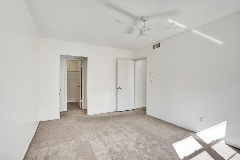 1050 Northwest 13th Street, Unit 193D Boca Raton, FL 33486 - Photo 23 of 55 a view of a big room with windows and ceiling fan